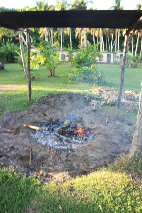 Lighting the earth oven